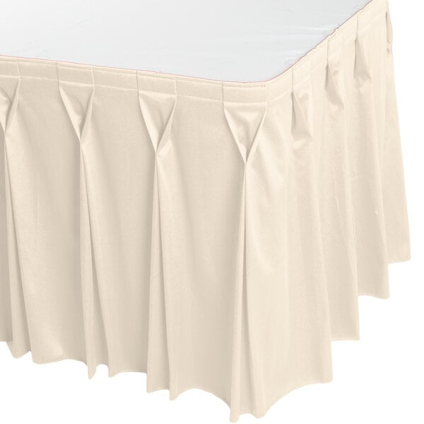 A bone Snap Drape table skirt with bow tie pleats.