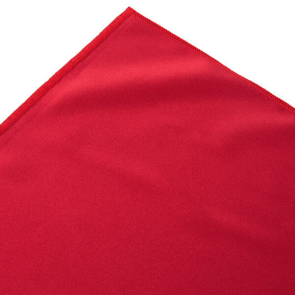A red table skirt with a box pleat edge.