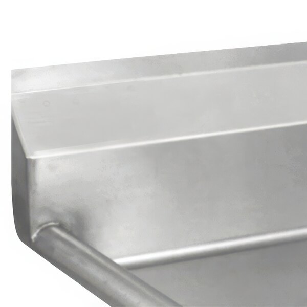An Advance Tabco one compartment pot sink with two drainboards on a metal bar.