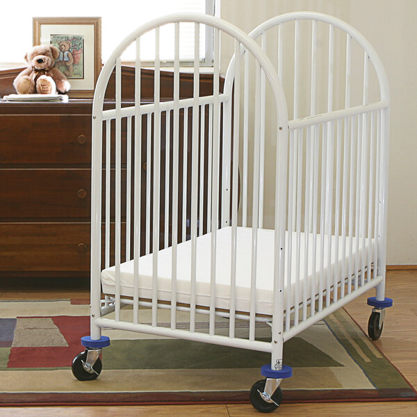 baby in mini crib
