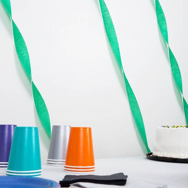 A green paper streamer on a white background.