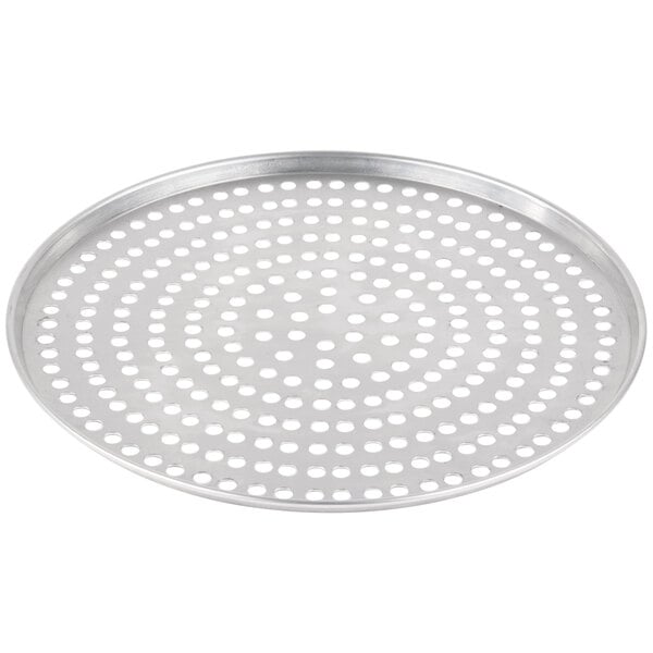 a round metal tray with holes