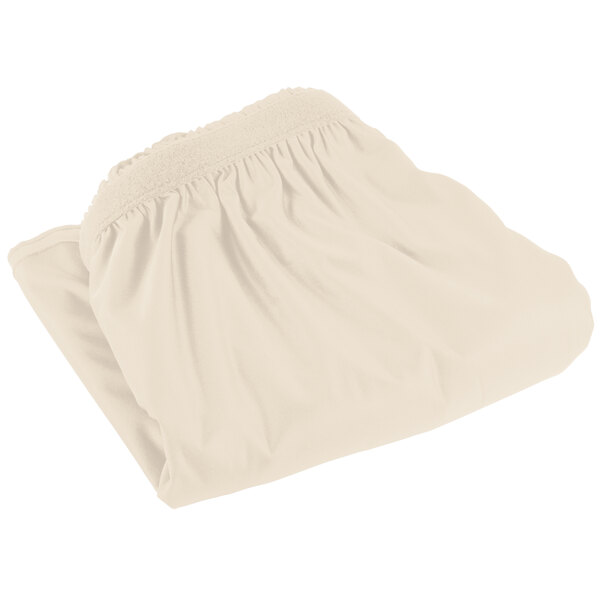 A folded white Snap Drape table skirt with a shirred pleat edge.