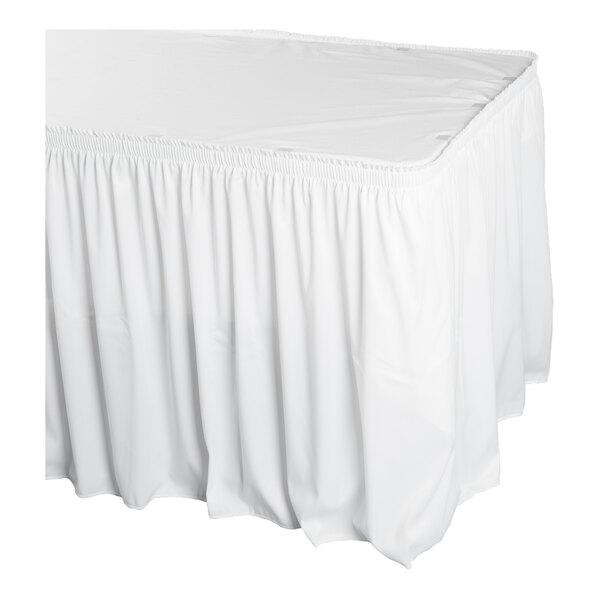 A white shirred pleat table skirt with Velcro clips designed to fit around a table.