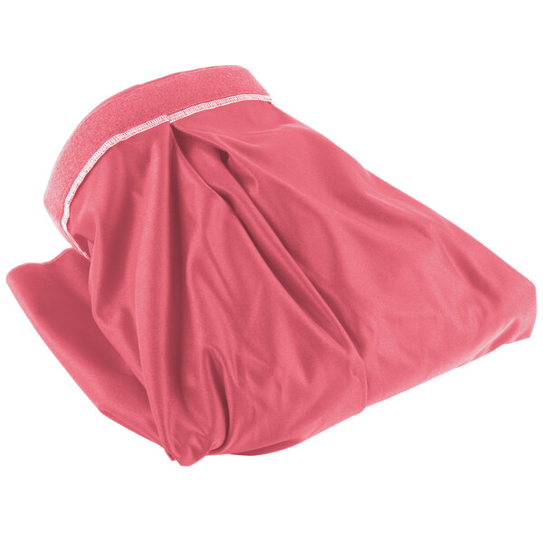 A pink table skirt with a white band on it.