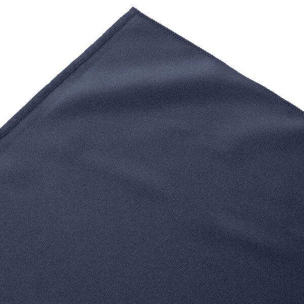 A folded navy blue Snap Drape table skirt with Velcro clips.
