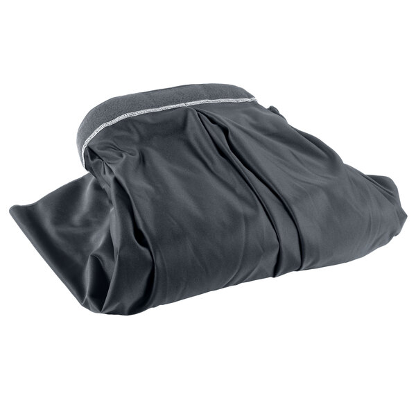 A slate blue table skirt in a black bag with a white stripe and velcro clips.