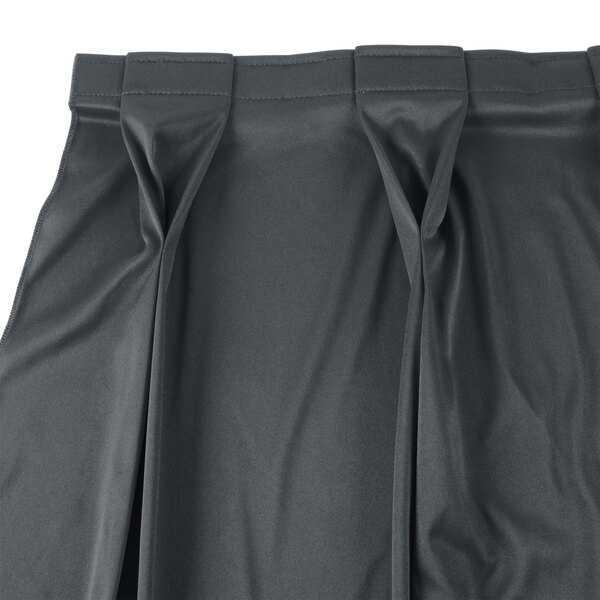 A slate blue Snap Drape Wyndham bow tie pleat table skirt with Velcro clips.