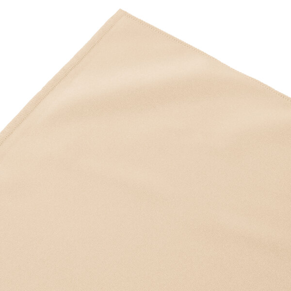 A cream Snap Drape shirred pleat table skirt with Velcro clips.