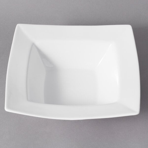 A close-up of a 10 Strawberry Street Whittier white square porcelain rim bowl.