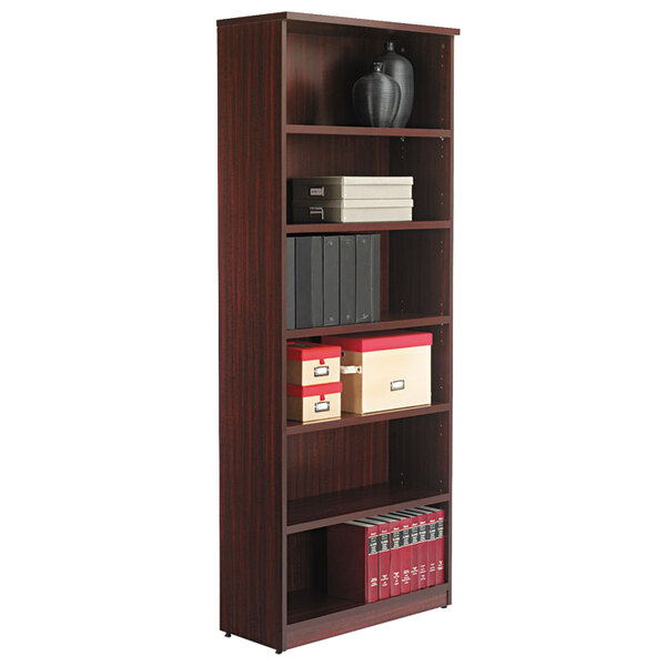 A mahogany Alera bookcase with books on shelves.