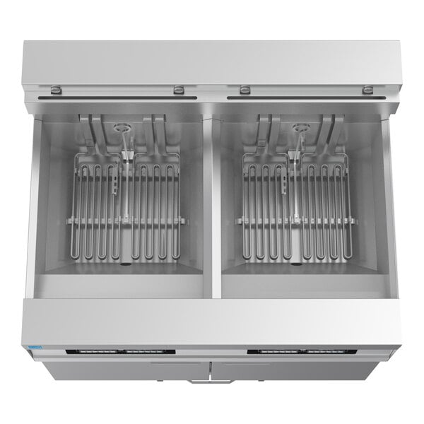 A commercial double electric floor fryer system with two frying compartments and integrated filtration, made of stainless steel.