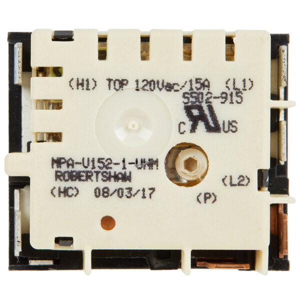 A white square electronic thermostat with black text and a white circle inside.
