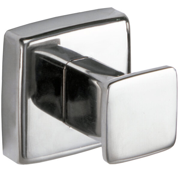 A close-up of a silver Bobrick surface-mounted robe hook.