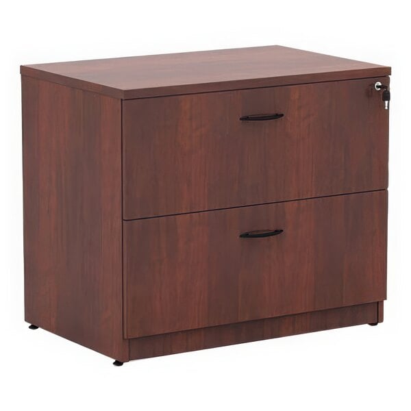 A wooden Alera Valencia filing cabinet with two drawers.