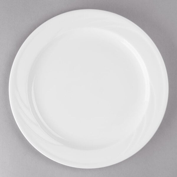 A white Libbey porcelain plate with a white rim.