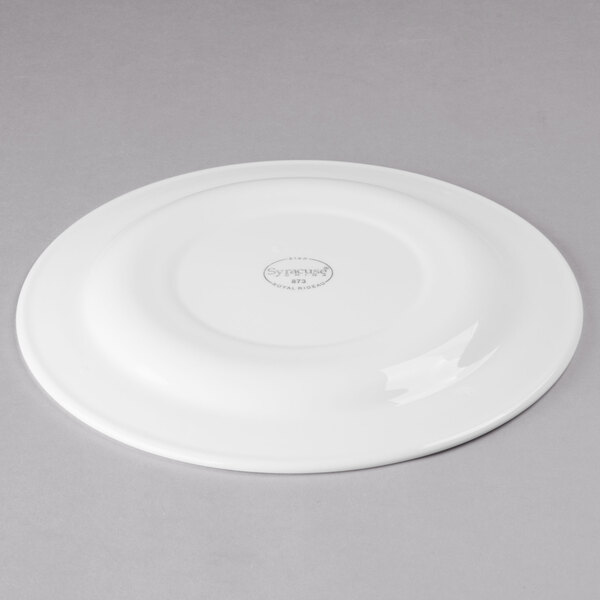 A white Libbey porcelain plate with a circular design on the rim.