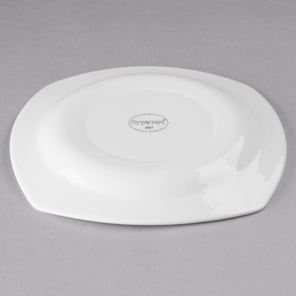 A white Libbey porcelain plate with a circular design on it.