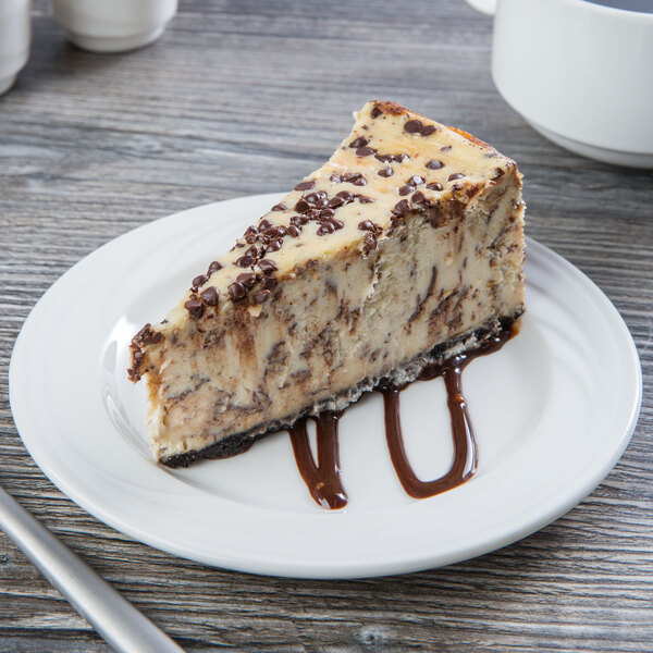 A slice of cheesecake on a Libbey Royal Rideau porcelain plate.