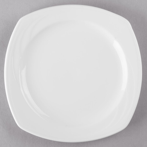 A Libbey Royal Rideau white porcelain plate on a gray surface.