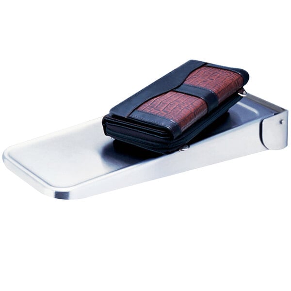 A wallet on a Bobrick stainless steel folding utility shelf.