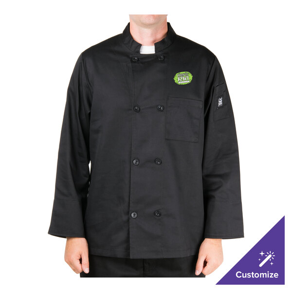 A person wearing a black Chef Revival chef jacket with a green logo on the chest.