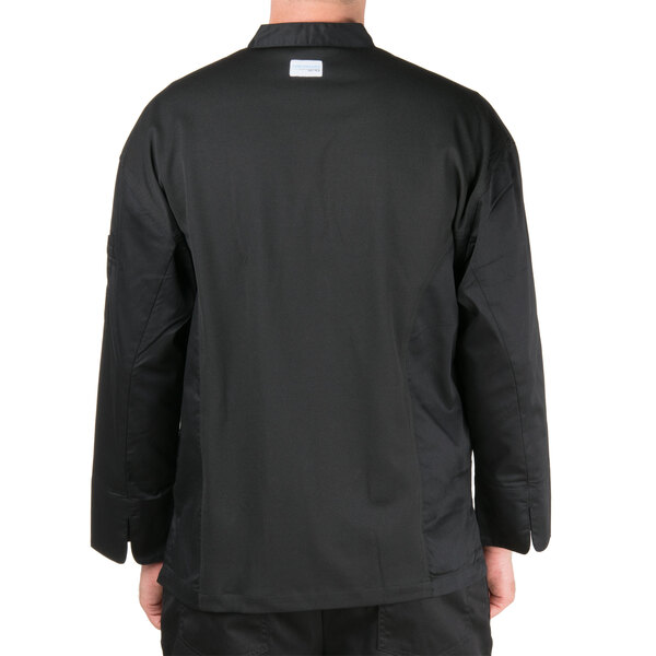 A man wearing a black Chef Revival chef jacket with mesh back.