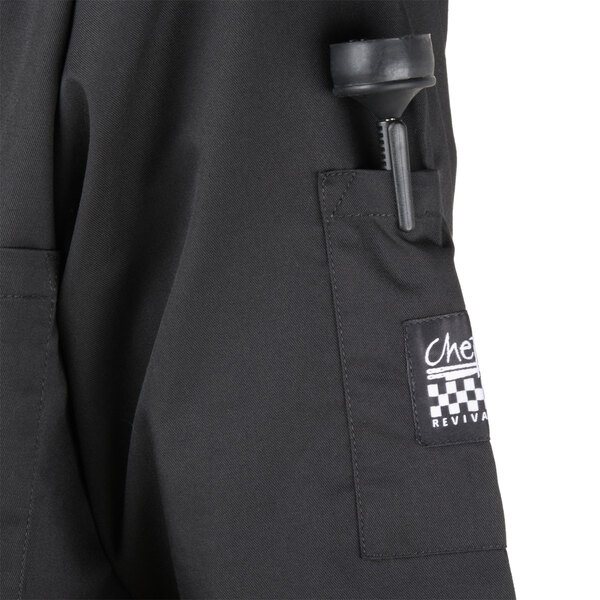 A close-up of the back pocket on a black Chef Revival chef coat.