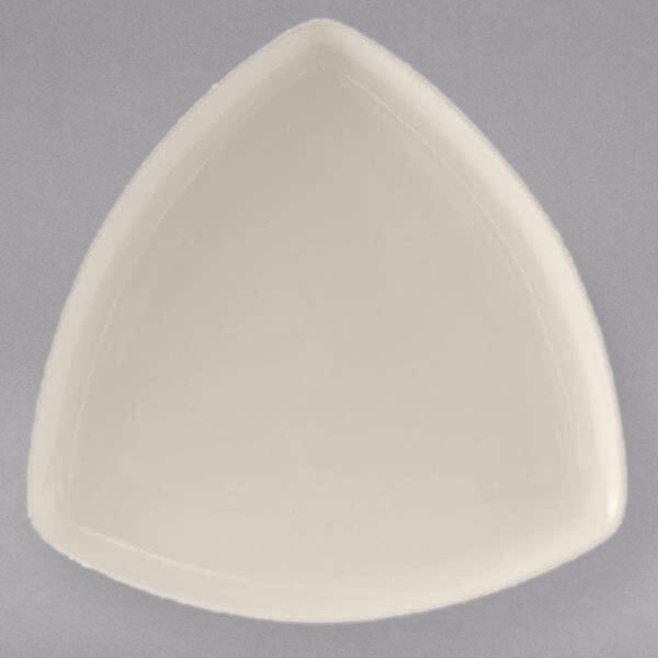 A white triangle shaped Tuxton eggshell china plate.