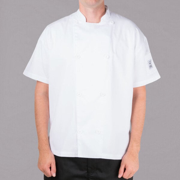 A man wearing a white Chef Revival chef jacket.
