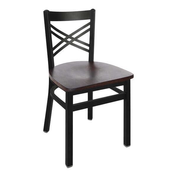 A BFM Seating black steel side chair with a walnut wooden seat.