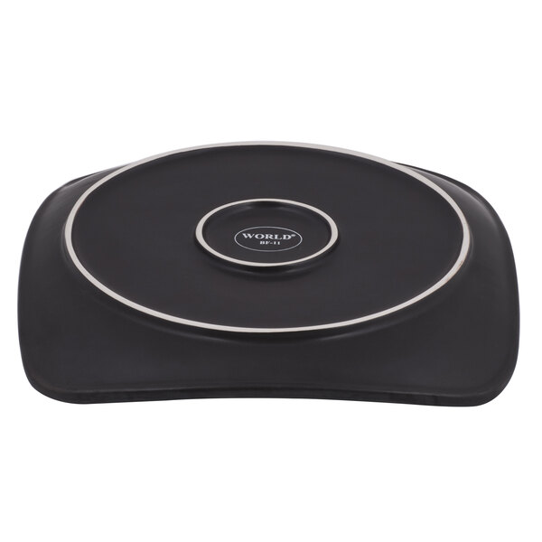 A black and white Libbey stoneware plate with round detailing.