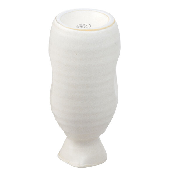 A white Libbey stoneware sake bottle with a handle.