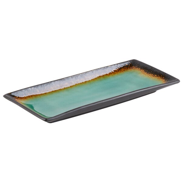 A Libbey Hakone stoneware rectangular platter with a green rim.