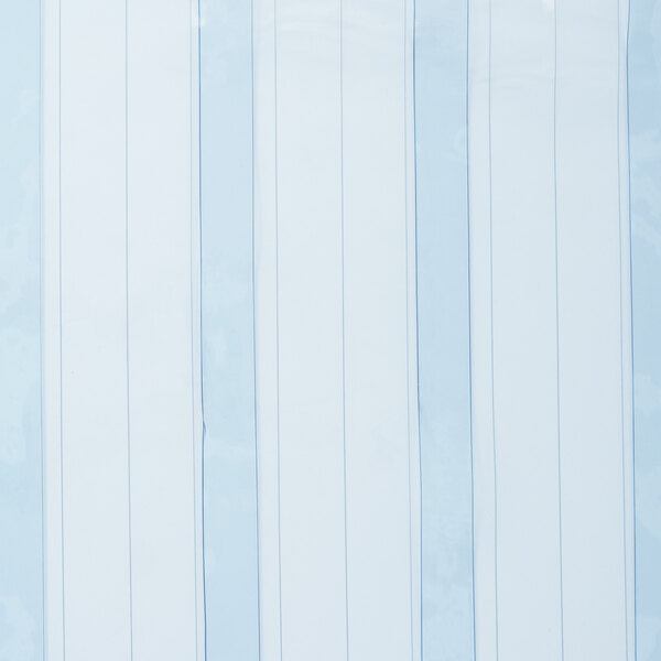 A white rectangular object with blue and white striped paper on it.