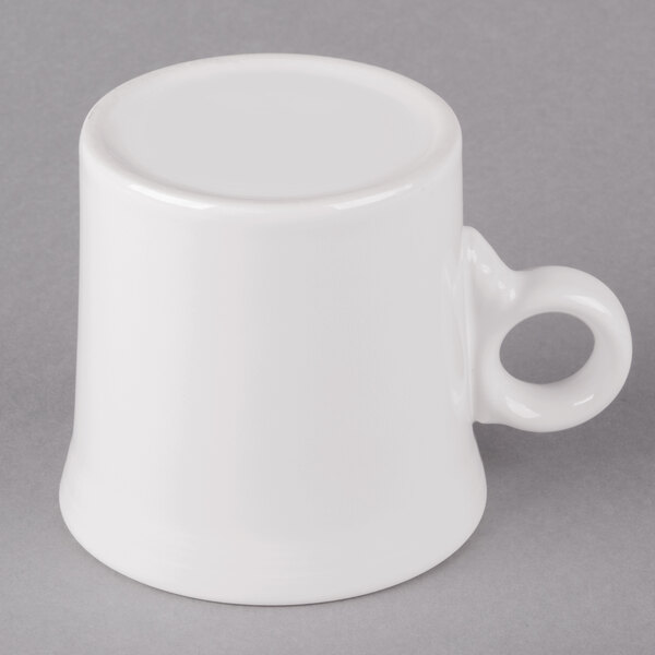 a close-up of a white teapot