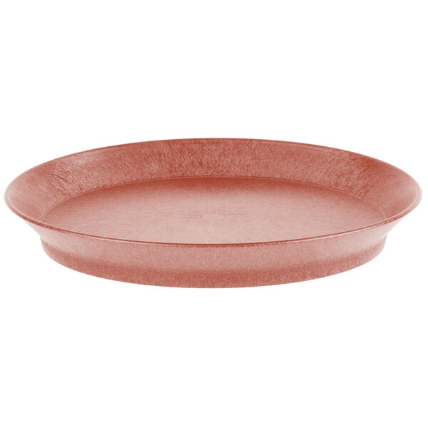 An oval paprika deli server with a short base on a counter.