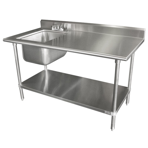 A stainless steel island clean L-shape dishtable with a sink, a drain, and a shelf.