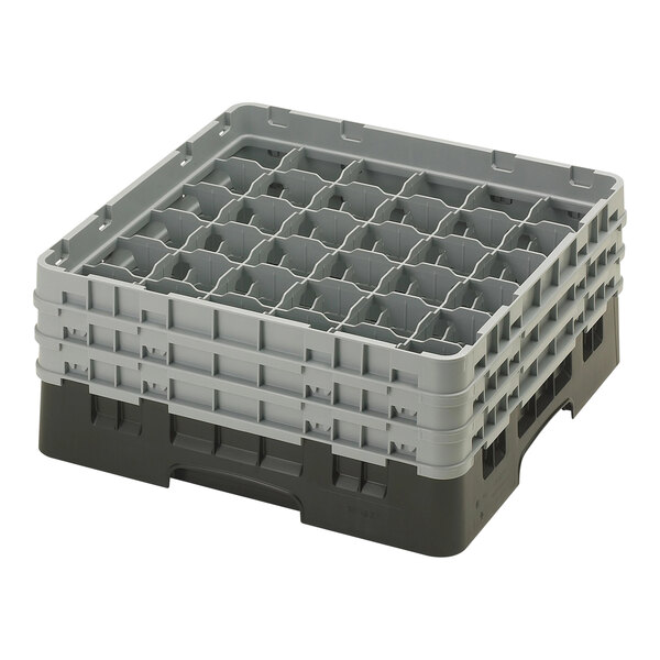 A black Cambro plastic glass rack with 36 compartments.