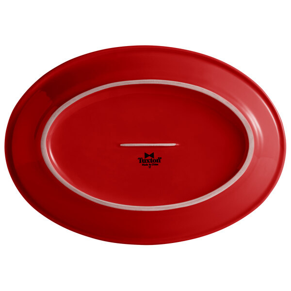 A red oval platter with a white border.