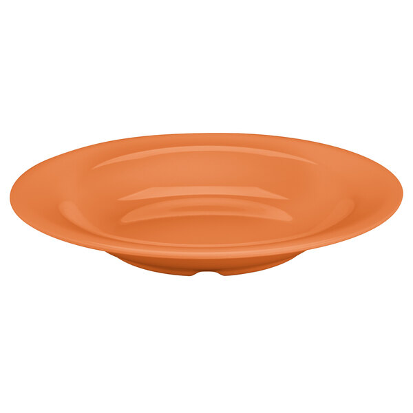 An orange pumpkin bowl with a white background.