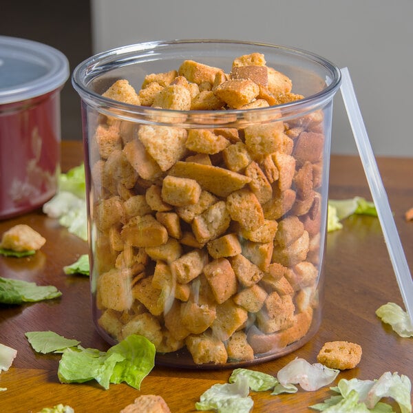 A Carlisle clear plastic crock full of vegetables.