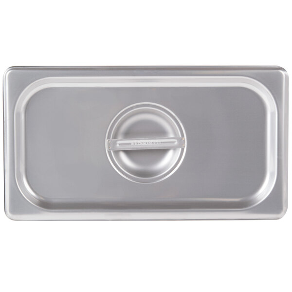 A Vollrath stainless steel lid on a stainless steel pan.