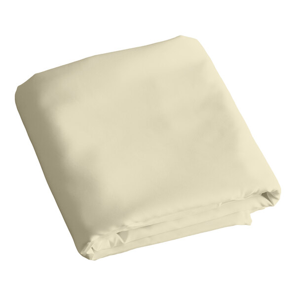 A folded ivory rectangular table cover.