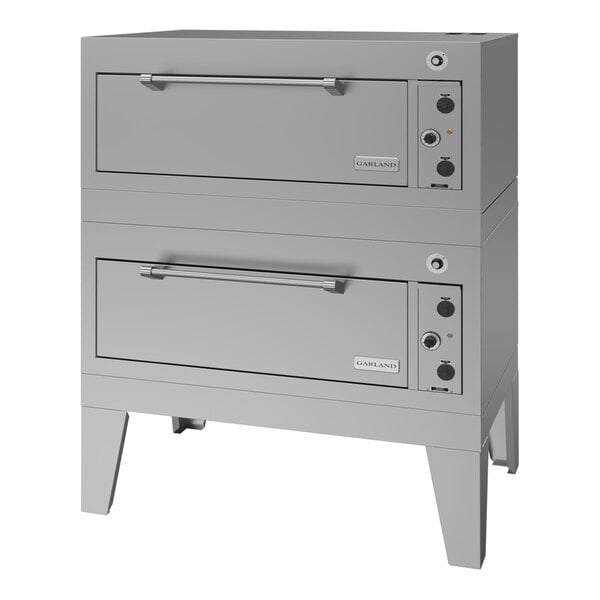 A double deck electric roast oven with a stainless steel exterior and control knobs on the right side.