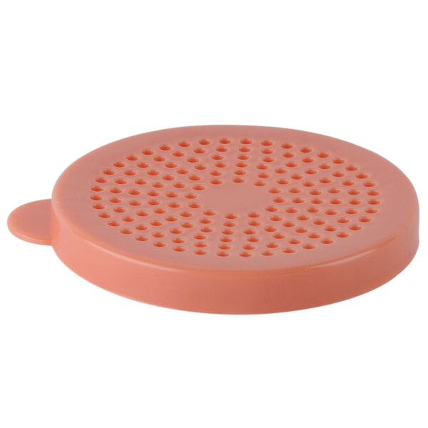 A close-up of a pink Tablecraft medium ground cheese shaker lid with holes.