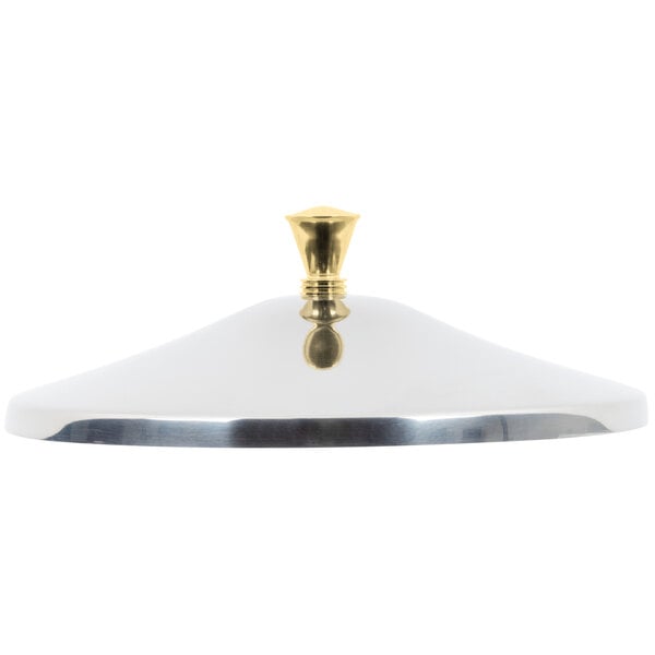 A stainless steel cover with a brass knob.