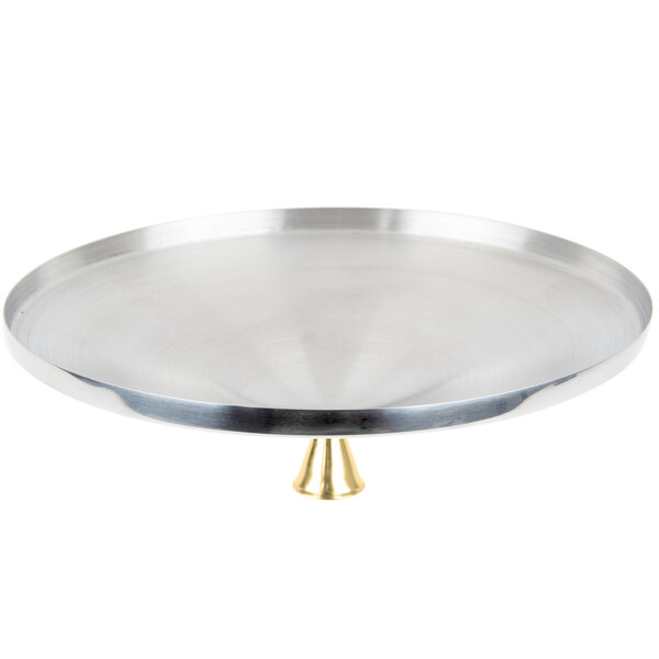 A silver tray with a gold handle.