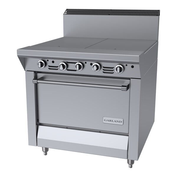 A commercial stainless steel natural gas range with two hot top sections and a standard oven.