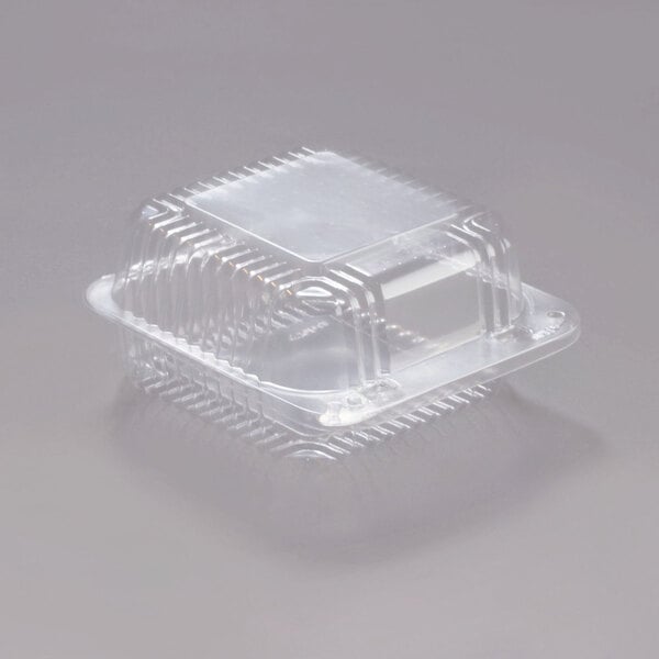 A Dart clear plastic container with a clear lid.